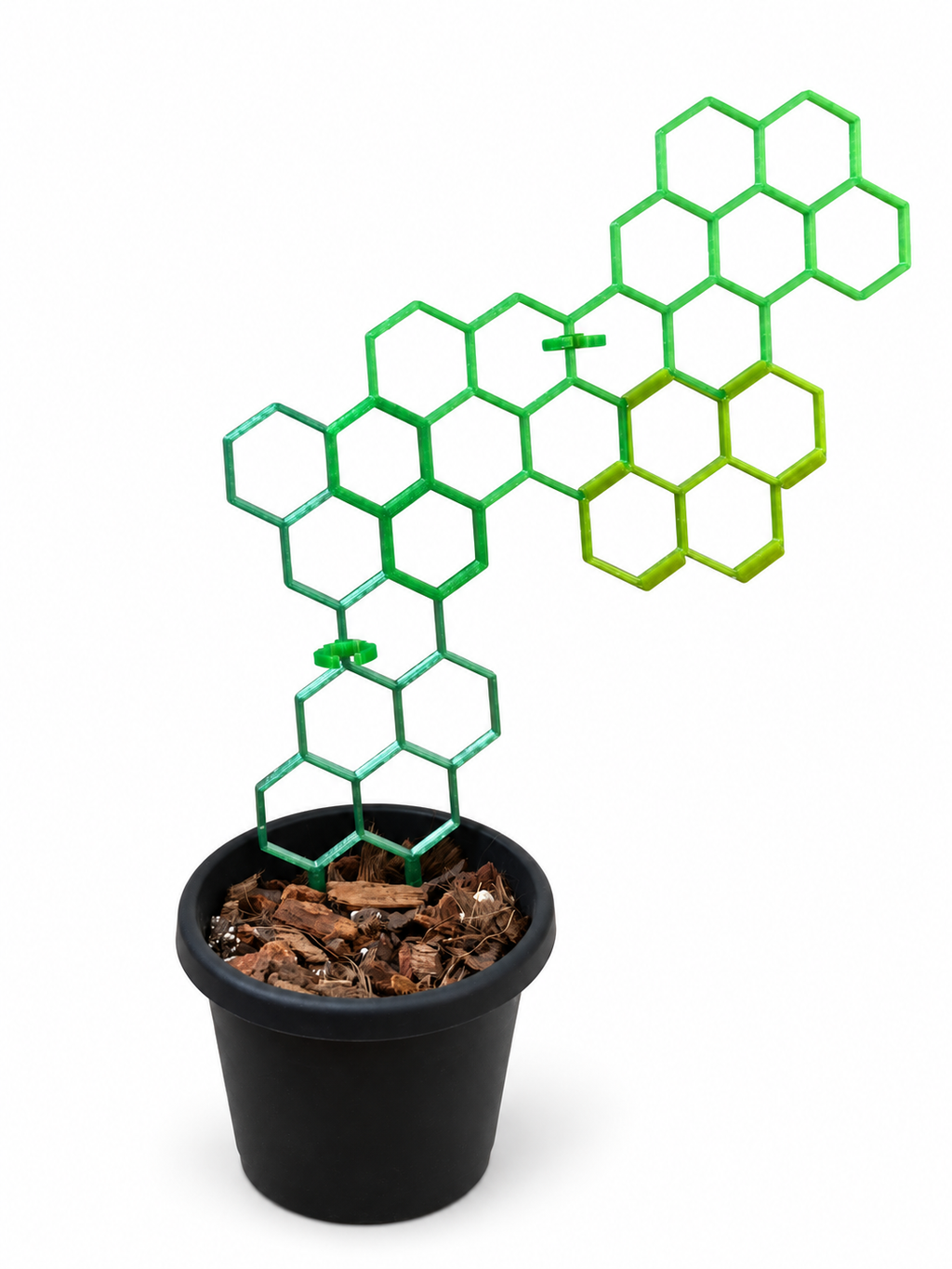 Green honeycomb trellis in an expanded example arrangement with clips and a black pot on a white background. Kit contains 1 base, 1 extension, and 2 clips; extra pieces and pot are not included.