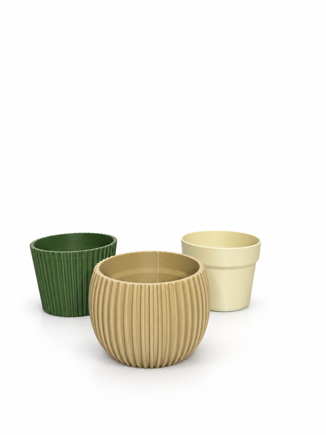 Three pot styles on a white background: green ribbed cylinder on the left, rounded ribbed beige pot in front, and smooth beige pot on the right.